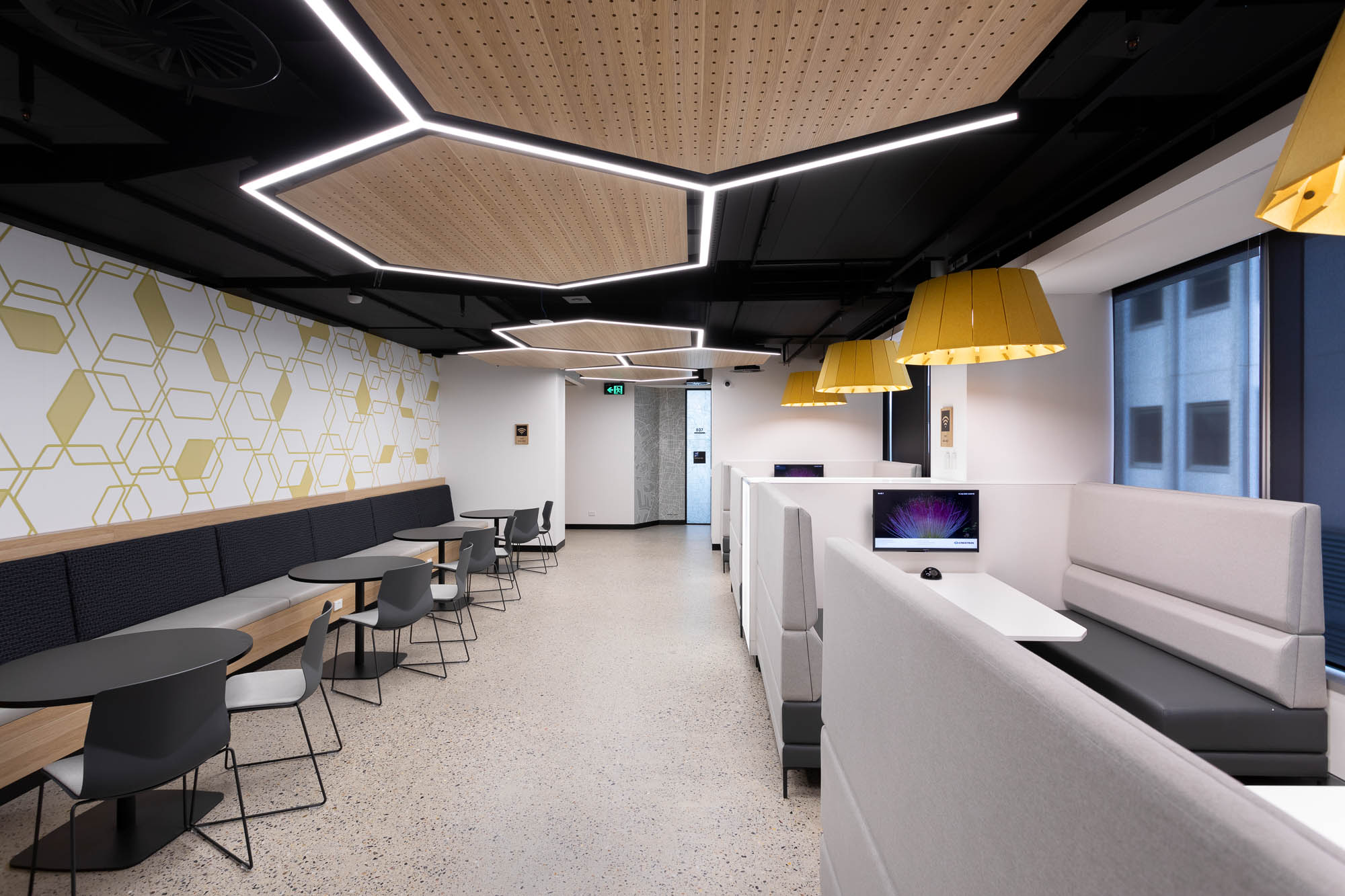 Federation University Collaboration space with hexagon lights, benches and meeting pods