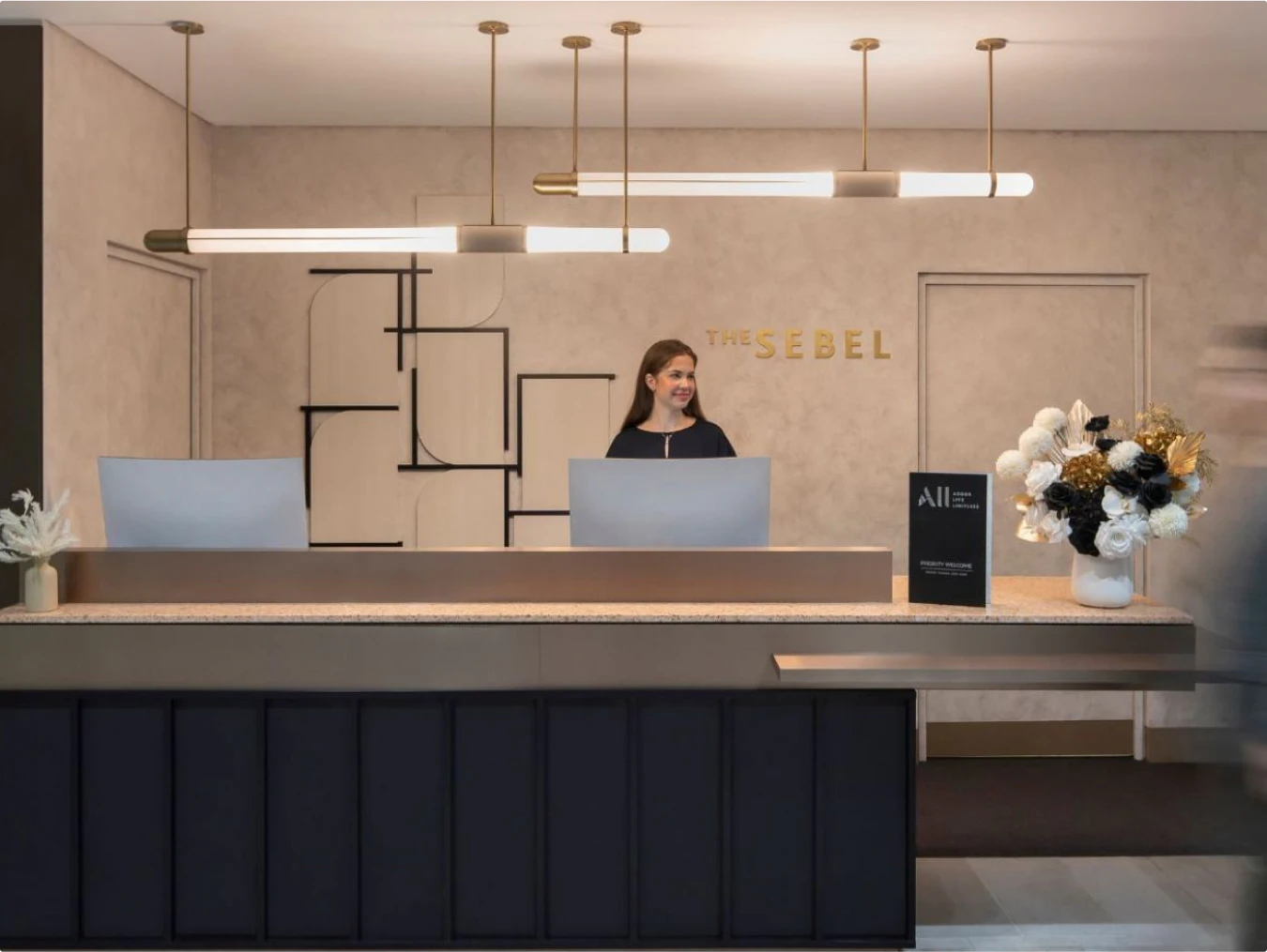 reception, furniture, table, adult, female, person, woman, indoors, lighting, foyer