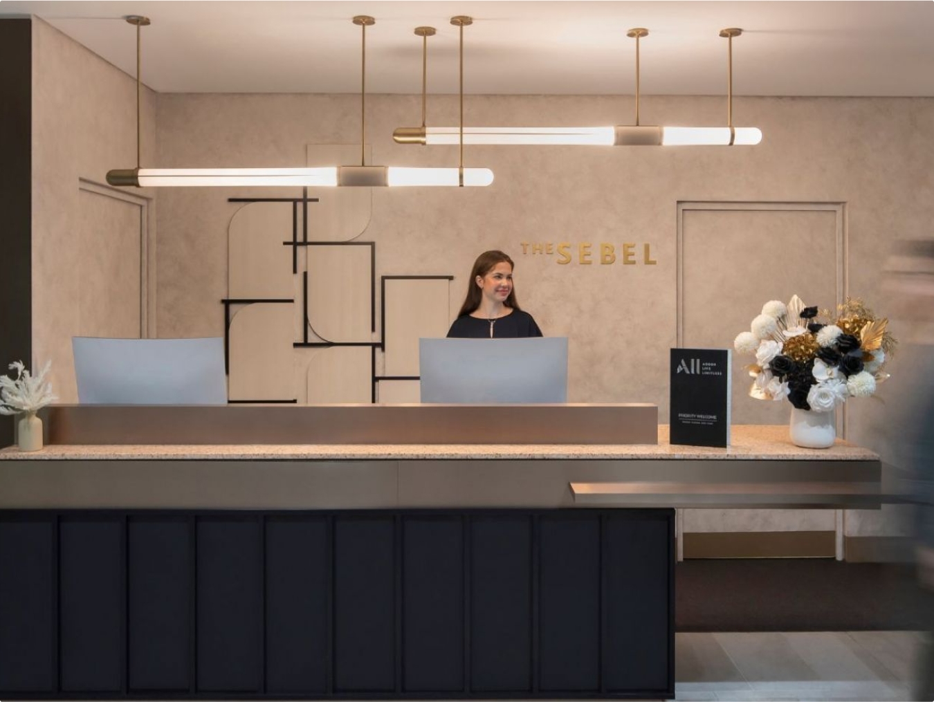 reception, furniture, table, adult, female, person, woman, indoors, lighting, foyer