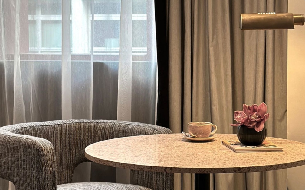 furniture, table, tabletop, indoors, interior design, cup, dining table, lamp
